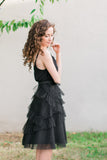 Exude evening drama in this gorgeous midi tulle skirt. The cascading ruffles give this skirt a special look and feel and lends a perfect texture to your outfit.      Fully lined with a hidden back zipper     All length is approximately 30"